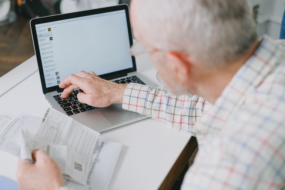 Veteran checking VA disability payment dates and direct deposit on a bank statement