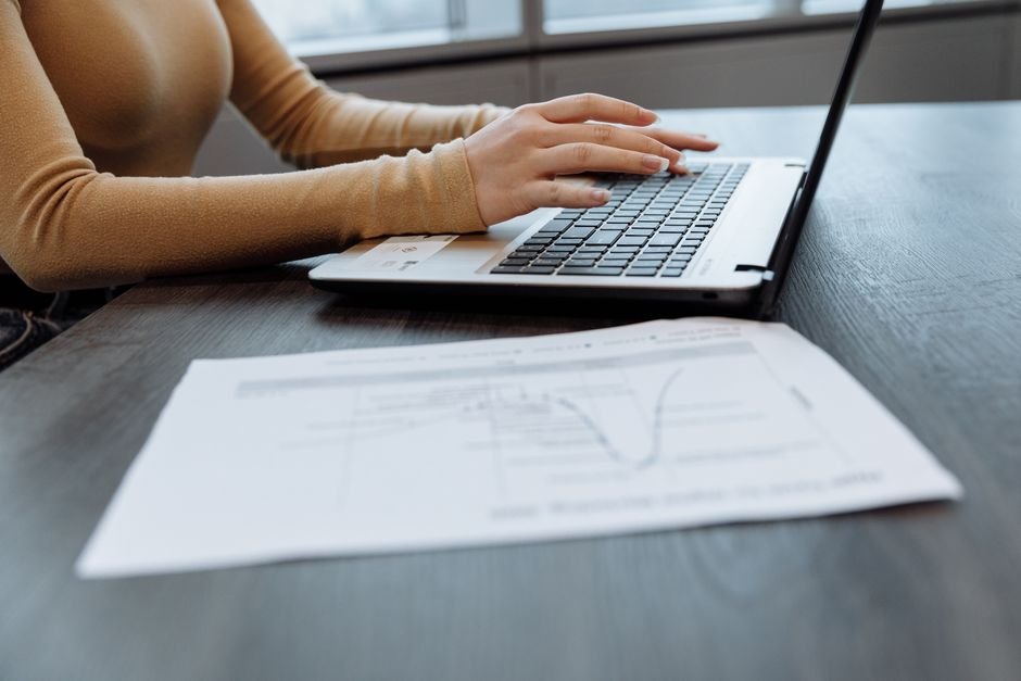 Laptop and paperwork used when learning how to check VA claim status online